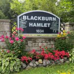 Entrance to Blackburn Hamlet sign and garden