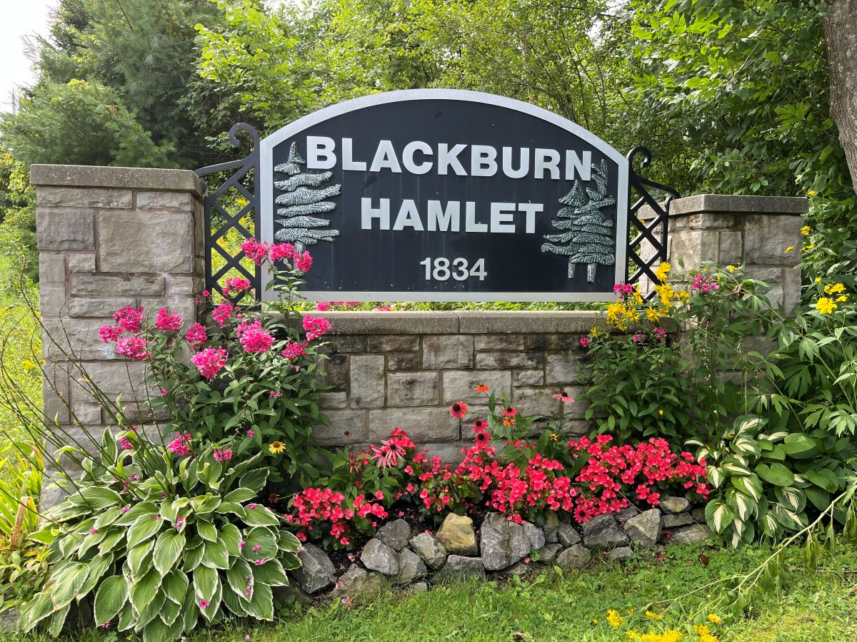 Entrance to Blackburn Hamlet sign and garden